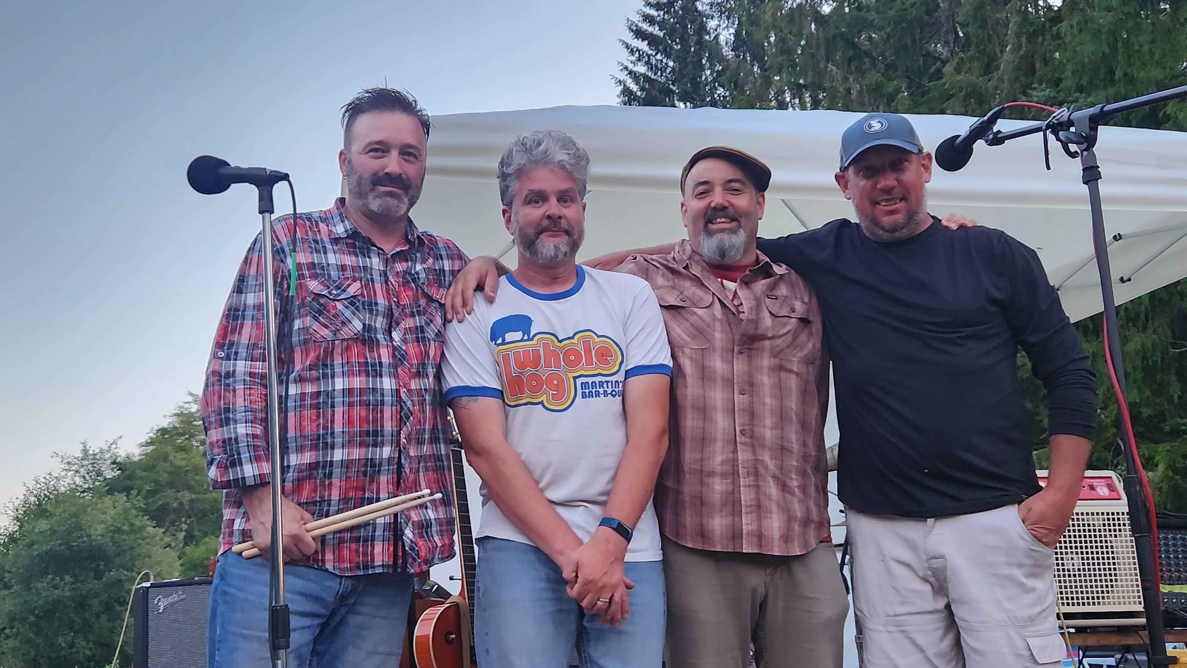 The Fender Benders band members standing together in Astoria, Oregon